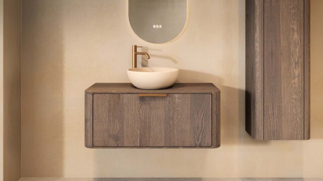 Hangend donker eiken wastafelmeubel 100 cm met afgeronde hoeken en beige limestone ronde waskom