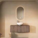 Rond hangend donker eiken wastafelmeubel 120 cm met afgeronde vorm en glanzend witte keramische waskom