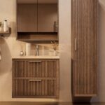 Het Riva badkamermeubel 80 in donker eiken ademt luxe en rust. Massief eiken met groevenfront, twee hoogwaardige softclose lades en een mat beige Mineraalsteen wastafel. De wastafel kan met of zonder kraangaten worden geleverd.
