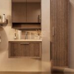 Het Riva badkamermeubel 80 in donker eiken ademt luxe en rust. Massief eiken met groevenfront, hoogwaardige softclose lades en een mat beige Mineraalsteen wastafel. De wastafel kan met of zonder kraangaten worden geleverd.