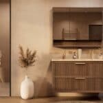 Het Riva badkamermeubel 120 in donker eiken ademt luxe en rust. Massief eiken met groevenfront, twee hoogwaardige softclose lades en een mat beige Mineraalsteen dubbele wastafel. De wastafel kan met of zonder kraangaten worden geleverd.