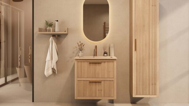 Het Riva badkamermeubel 70 in naturel eiken combineert ambachtelijk vakmanschap met moderne luxe. Gemaakt van massief eiken met ribbelfront, twee softclose lades en een mat beige Mineraalsteen wastafel. De wastafel kan met of zonder kraangaten worden