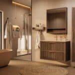 Het Riva badkamermeubel 100 in donker eiken ademt luxe en rust. Massief eiken met groevenfront, twee hoogwaardige softclose lades en een mat beige Mineraalsteen wastafel. De wastafel kan met of zonder kraangaten worden geleverd.