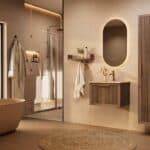 Het Riva badkamermeubel 60 in donker eiken ademt luxe en rust. Massief eiken met groevenfront, hoogwaardige softclose lades en een mat beige Mineraalsteen wastafel. De wastafel kan met of zonder kraangaten worden geleverd.