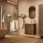 Het Riva badkamermeubel 60 in donker eiken ademt luxe en rust. Massief eiken met groevenfront, twee hoogwaardige softclose lades en een mat beige Mineraalsteen wastafel. De wastafel kan met of zonder kraangaten worden geleverd.