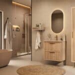 Het Riva badkamermeubel 70 in naturel eiken combineert ambachtelijk vakmanschap met moderne luxe. Gemaakt van massief eiken met ribbelfront, twee softclose lades en een mat beige Mineraalsteen wastafel. De wastafel kan met of zonder kraangaten worden